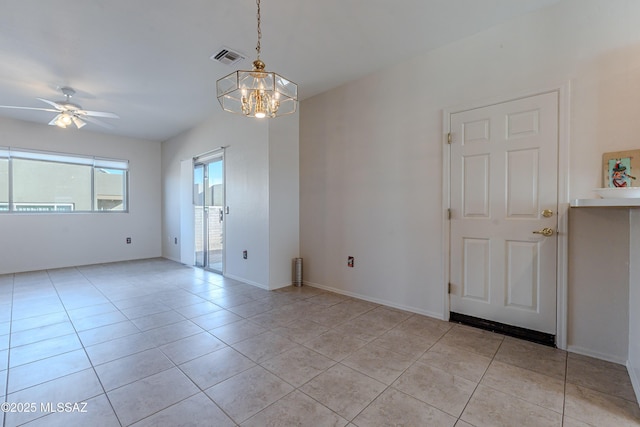 unfurnished room featuring light tile patterned floors, visible vents, baseboards, and ceiling fan with notable chandelier