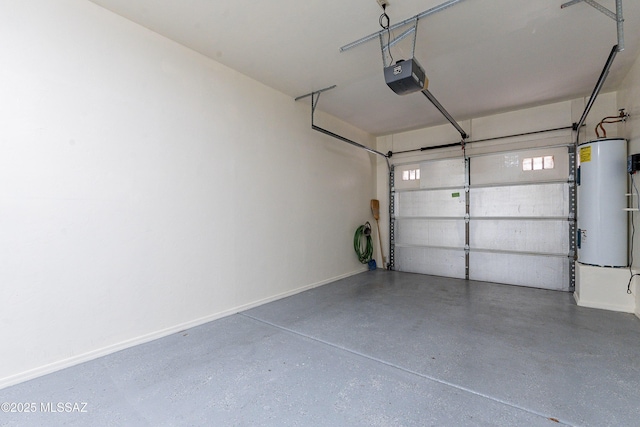 garage featuring baseboards, a garage door opener, and water heater