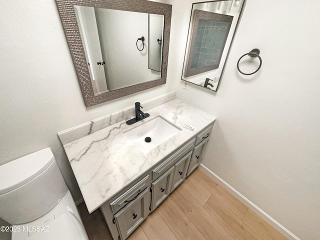 bathroom with vanity and hardwood / wood-style floors