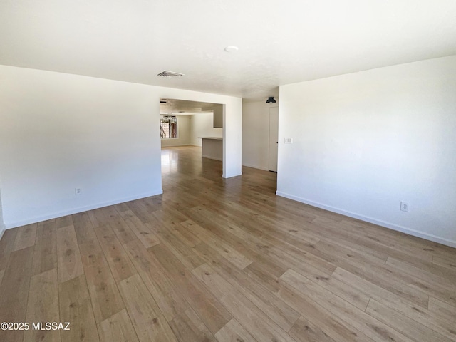 spare room with light hardwood / wood-style flooring