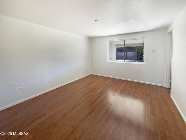 empty room featuring hardwood / wood-style floors