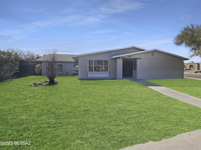 ranch-style house with a front lawn