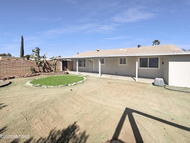 back of house featuring a patio