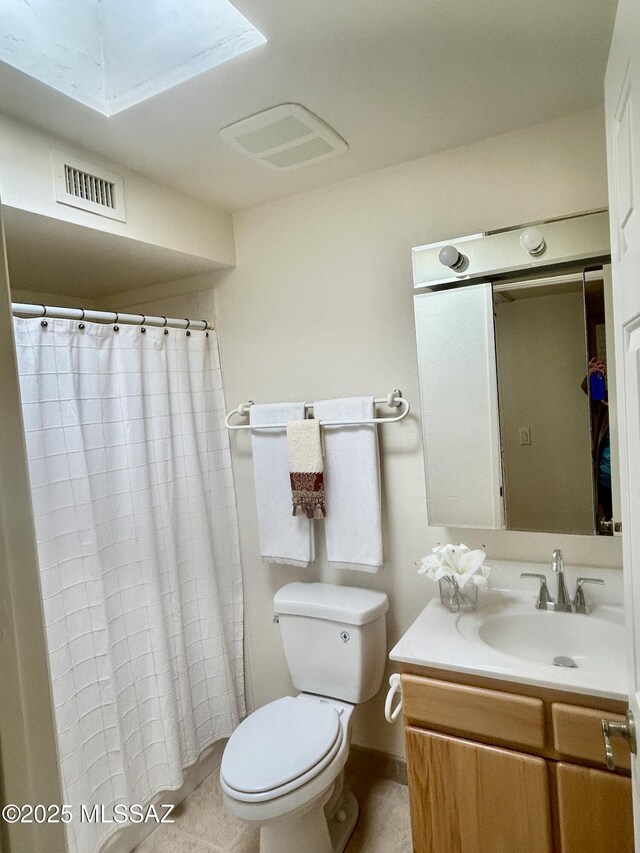 bathroom featuring baseboards, vanity, tile patterned floors, and a shower with shower door