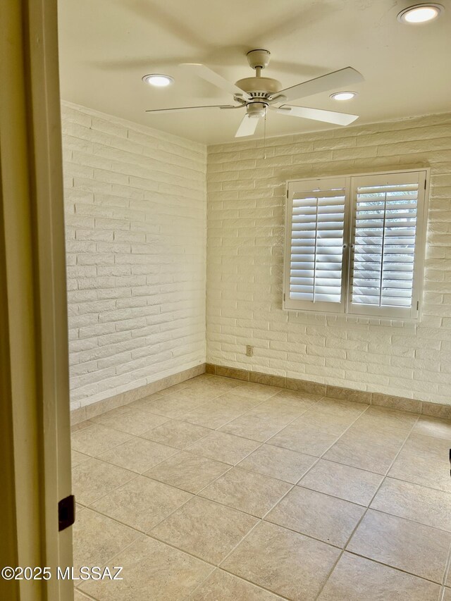 bathroom featuring a shower stall, baseboards, and tile patterned flooring