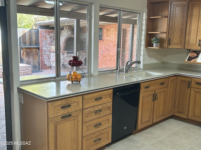kitchen featuring brown cabinets, open shelves, black dishwasher, and a sink