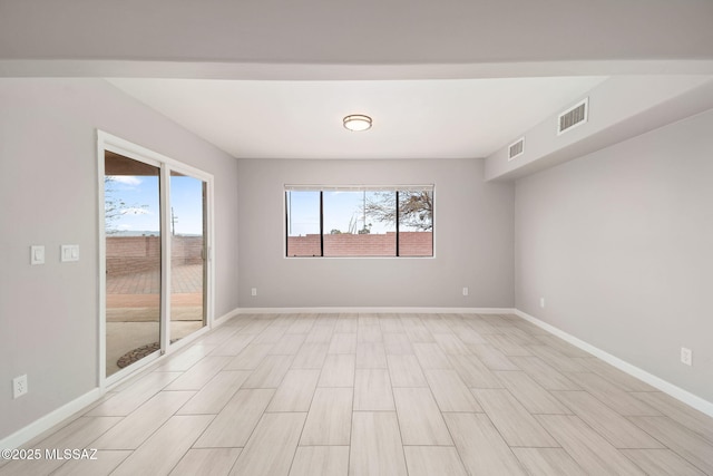 3098 S Giovanna Dr, Tucson, AZ 85730 - unfurnished room featuring plenty of natural light and baseboards