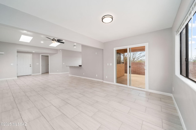 3098 S Giovanna Dr, Tucson, AZ 85730 - unfurnished room featuring a skylight, a ceiling fan, and baseboards