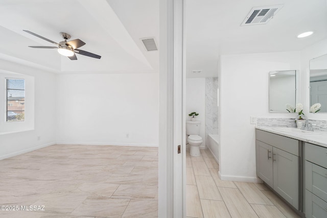 3098 S Giovanna Dr, Tucson, AZ 85730 - bathroom with vanity, ceiling fan, baseboards, and toilet