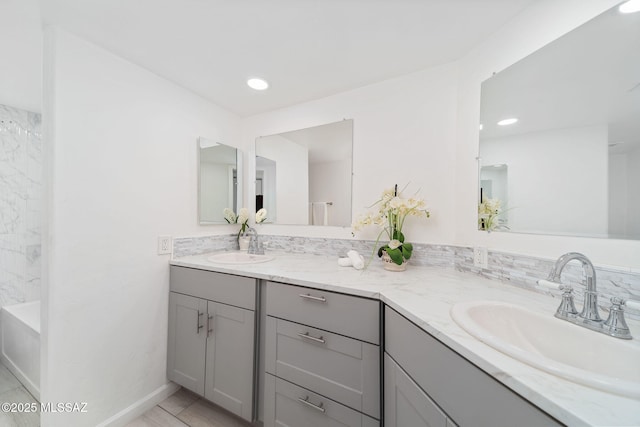 3098 S Giovanna Dr, Tucson, AZ 85730 - full bathroom featuring double vanity, a bath, tile patterned flooring, and recessed lighting