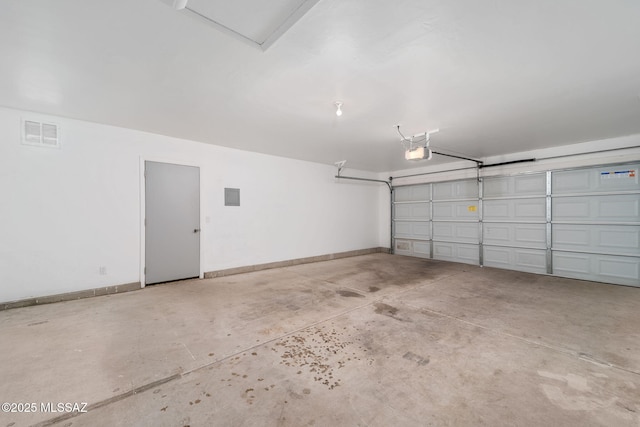 3098 S Giovanna Dr, Tucson, AZ 85730 - garage featuring a garage door opener and baseboards