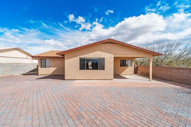 3098 S Giovanna Dr, Tucson, AZ 85730 - rear view of property with stucco siding and a patio area