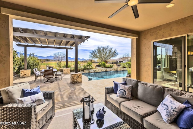 view of patio / terrace with a mountain view, outdoor lounge area, ceiling fan, a pergola, and a fenced in pool