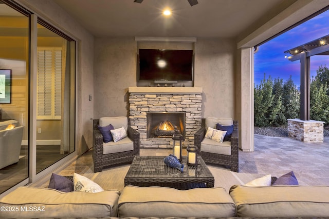 view of patio / terrace with an outdoor stone fireplace