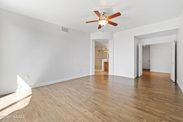 unfurnished room with wood-type flooring and ceiling fan