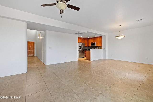 unfurnished living room with light tile patterned flooring and ceiling fan