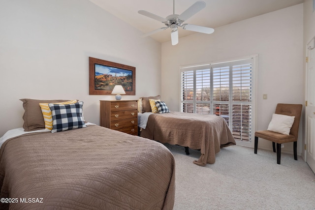 bedroom featuring ceiling fan, lofted ceiling, and carpet floors