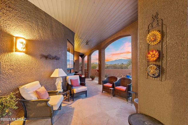 patio terrace at dusk with a mountain view