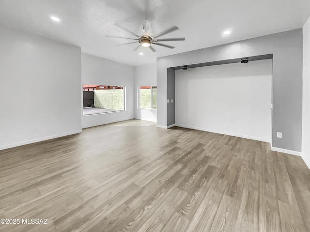 341 S Tucson Blvd, Tucson, AZ 85716 - unfurnished living room featuring baseboards, wood finished floors, recessed lighting, and ceiling fan