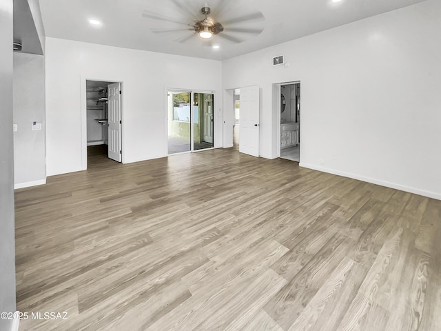 341 S Tucson Blvd, Tucson, AZ 85716 - unfurnished bedroom with a spacious closet, light wood-style floors, and a closet