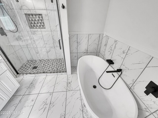 341 S Tucson Blvd, Tucson, AZ 85716 - full bath with a shower stall, marble finish floor, and a soaking tub