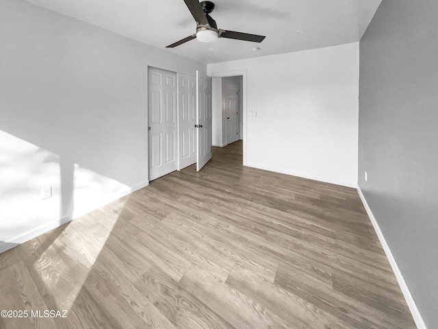 341 S Tucson Blvd, Tucson, AZ 85716 - spare room with wood finished floors, baseboards, and ceiling fan