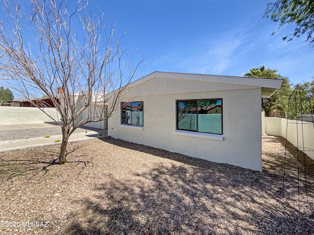 341 S Tucson Blvd, Tucson, AZ 85716 - view of side of property with a fenced backyard and stucco siding