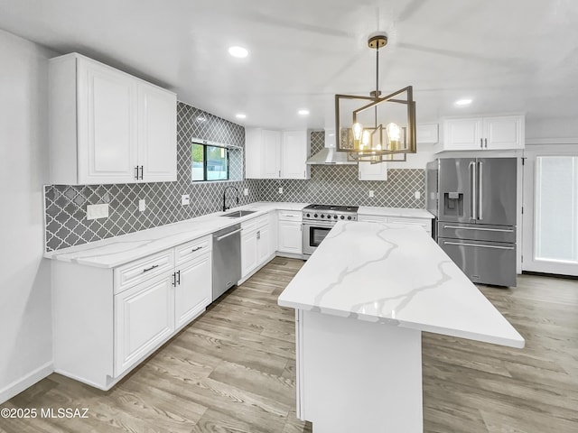 341 S Tucson Blvd, Tucson, AZ 85716 - kitchen with a center island, a sink, decorative backsplash, a chandelier, and appliances with stainless steel finishes