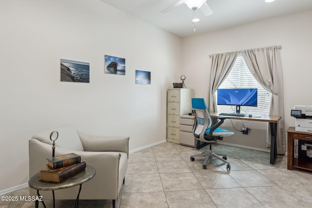 office featuring light tile patterned floors, baseboards, and ceiling fan