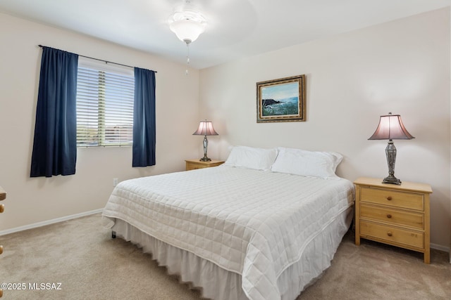 bedroom with carpet flooring and baseboards