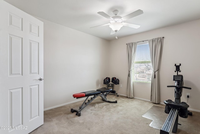 workout area with baseboards, carpet floors, and ceiling fan