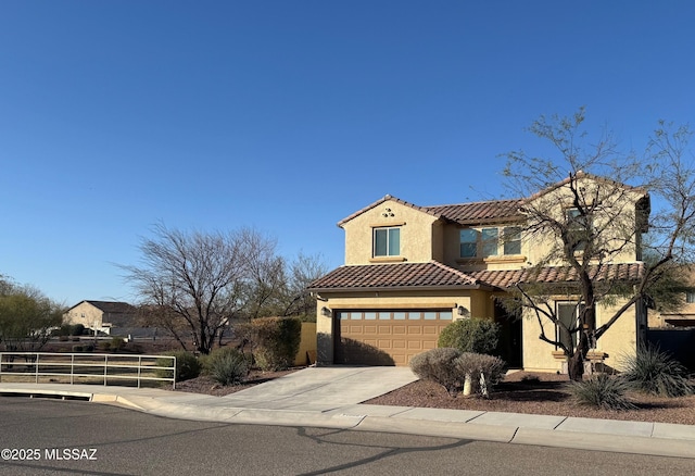 mediterranean / spanish house featuring fence, driveway, an attached garage, stucco siding, and a tile roof