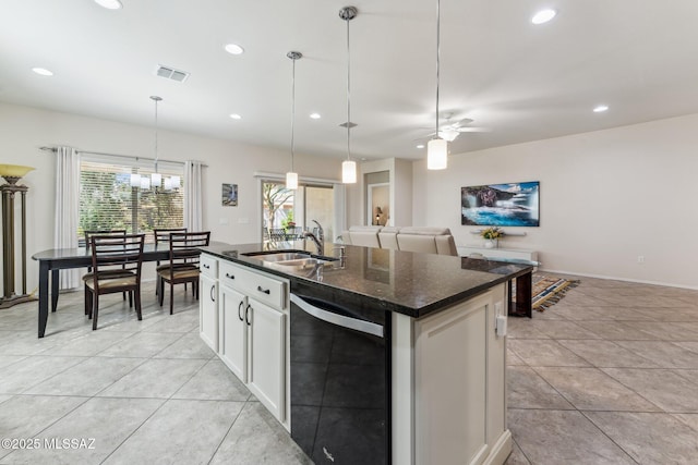 kitchen featuring dishwasher, pendant lighting, light tile patterned floors, recessed lighting, and a sink