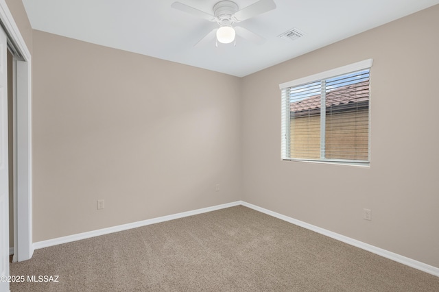 carpeted empty room with ceiling fan