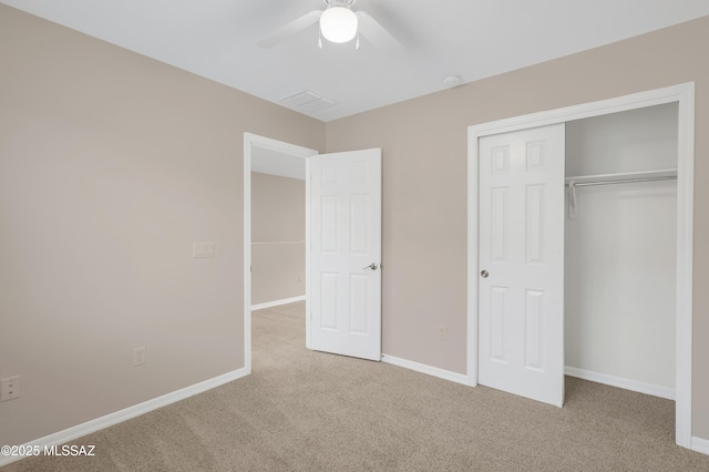 unfurnished bedroom with light carpet, a closet, and ceiling fan