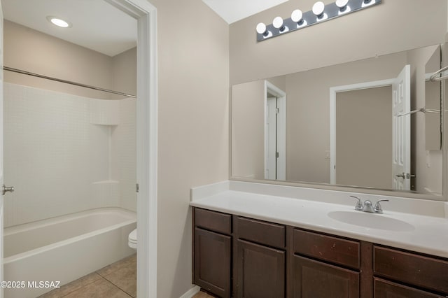 full bathroom featuring washtub / shower combination, tile patterned floors, toilet, and vanity