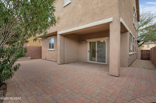 back of property with a patio area