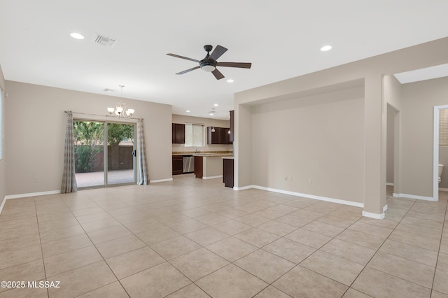 unfurnished living room featuring light tile patterned flooring and ceiling fan with notable chandelier