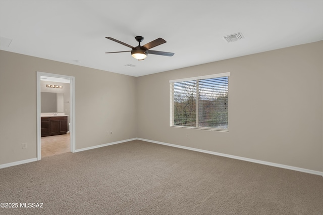 carpeted empty room with ceiling fan