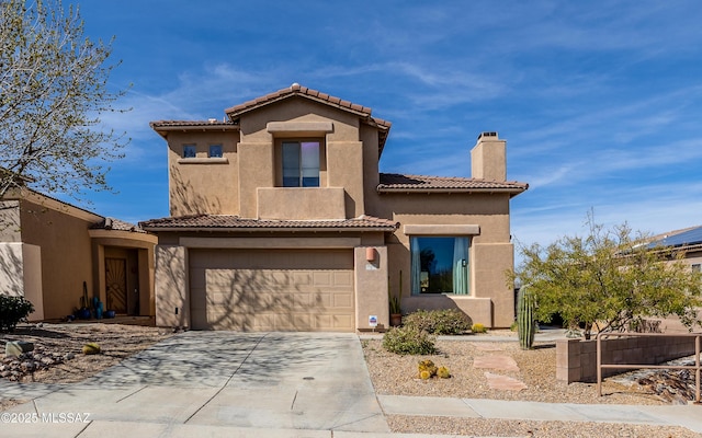 mediterranean / spanish house featuring an attached garage, driveway, a tiled roof, stucco siding, and a chimney