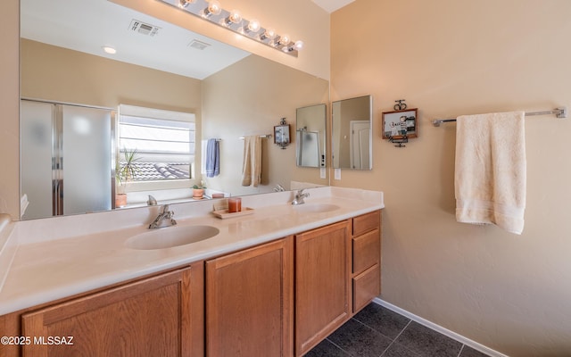 13289 E Wranglers Rest Dr, Vail, AZ 85641 - bathroom with double vanity, tile patterned flooring, and baseboards
