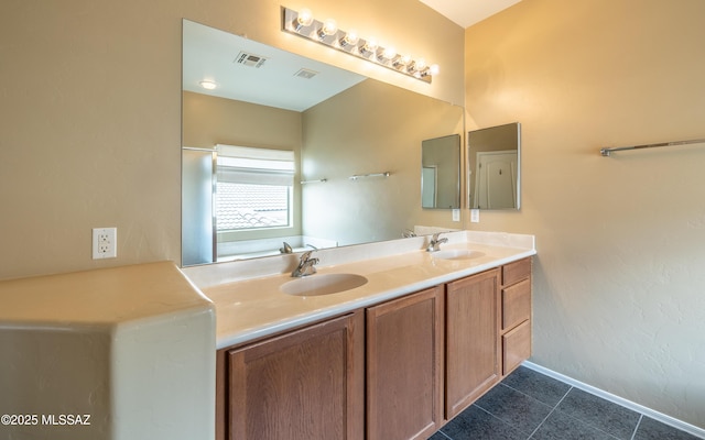 13289 E Wranglers Rest Dr, Vail, AZ 85641 - bathroom featuring baseboards, tile patterned floors, and double vanity
