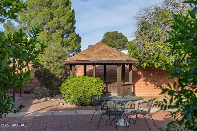 view of patio / terrace featuring a gazebo and outdoor dining space