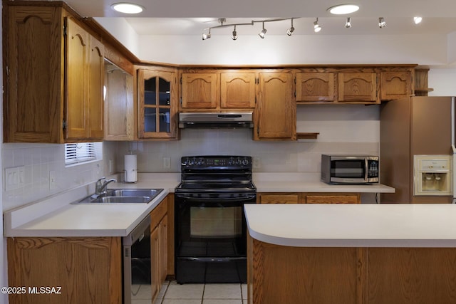 kitchen with black electric range oven, stainless steel microwave, under cabinet range hood, white refrigerator with ice dispenser, and a sink