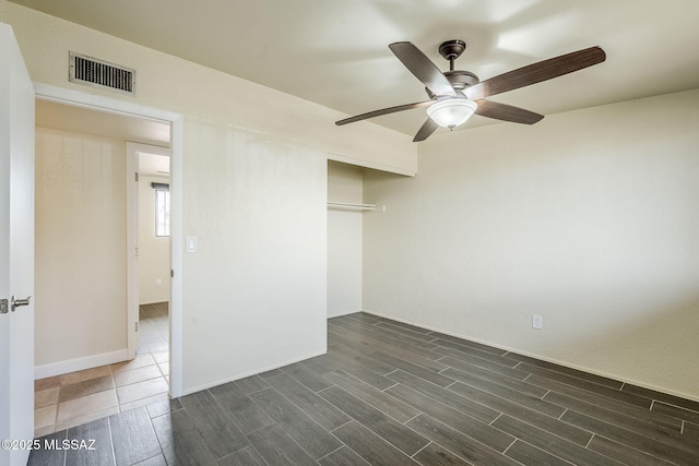 unfurnished bedroom with a closet and ceiling fan