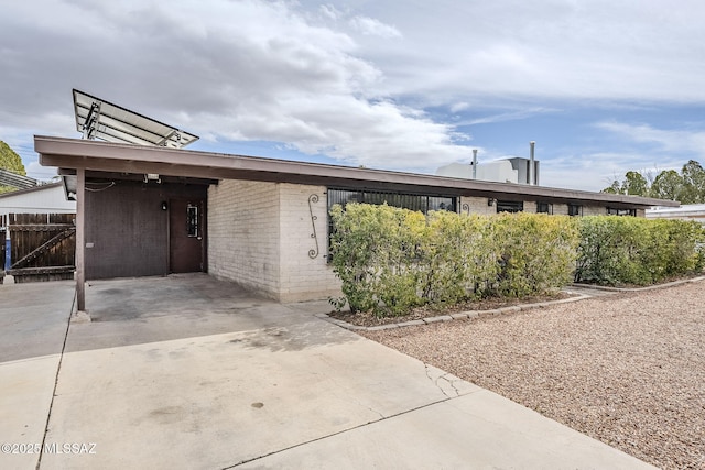 exterior space featuring a carport