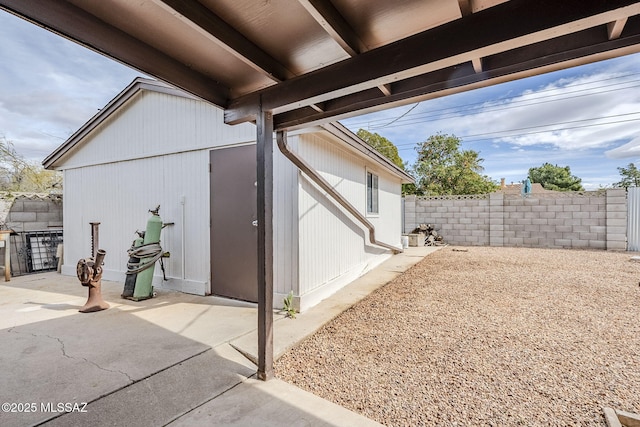 view of side of property with a patio