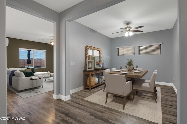 dining space with hardwood / wood-style flooring and ceiling fan