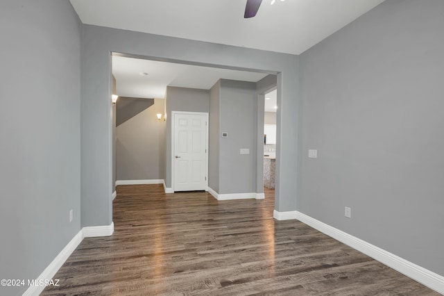 spare room featuring dark hardwood / wood-style floors and ceiling fan