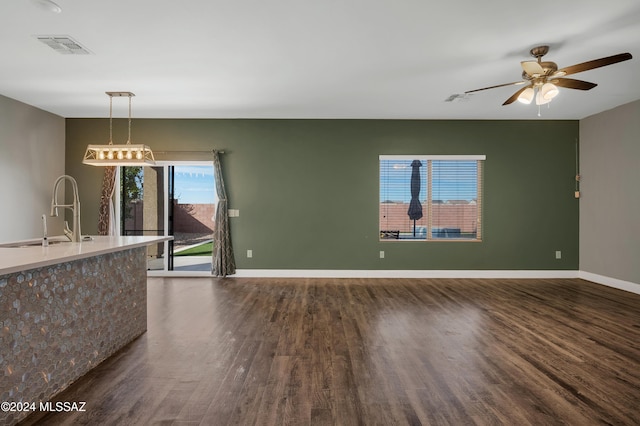 interior space featuring sink, hardwood / wood-style flooring, and ceiling fan